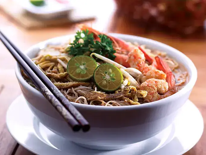Laksa Sarawak, a spicy noodle soup, showcasing our flavorful meal offerings