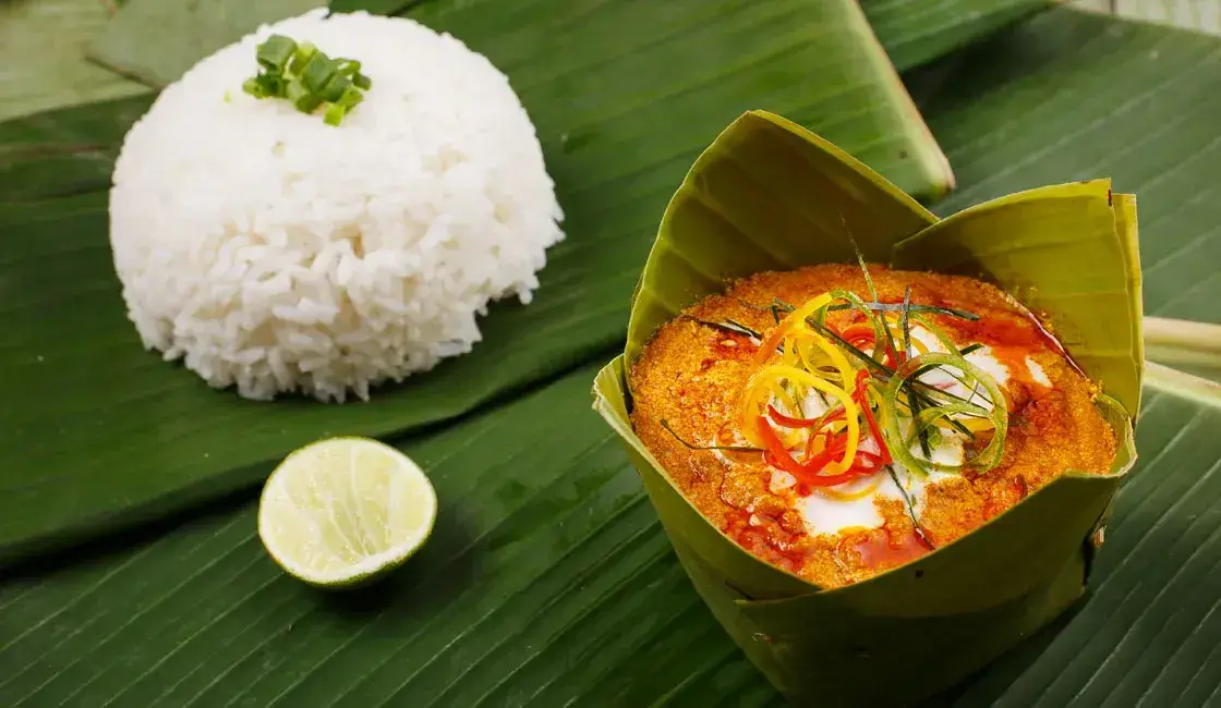 Steamed fish curry served in a banana leaf